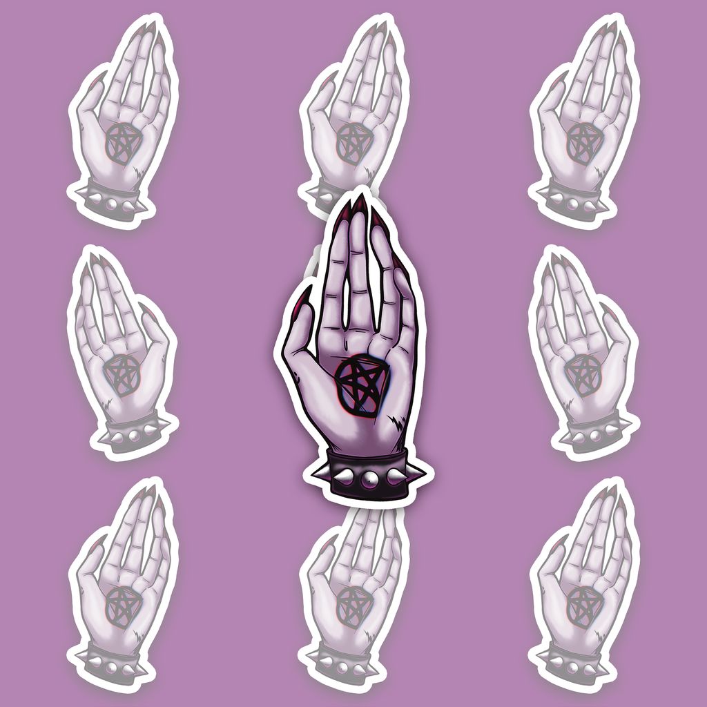 Pale lavender hand with pointed nails, a dark pentagram marking on the palm and a black spiked wrist cuff.
