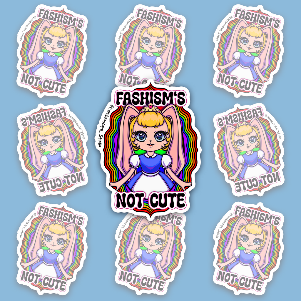 Pastel fantasy character with large pink ears surrounded by rainbow colors and the words Fascism’s Not Cute.