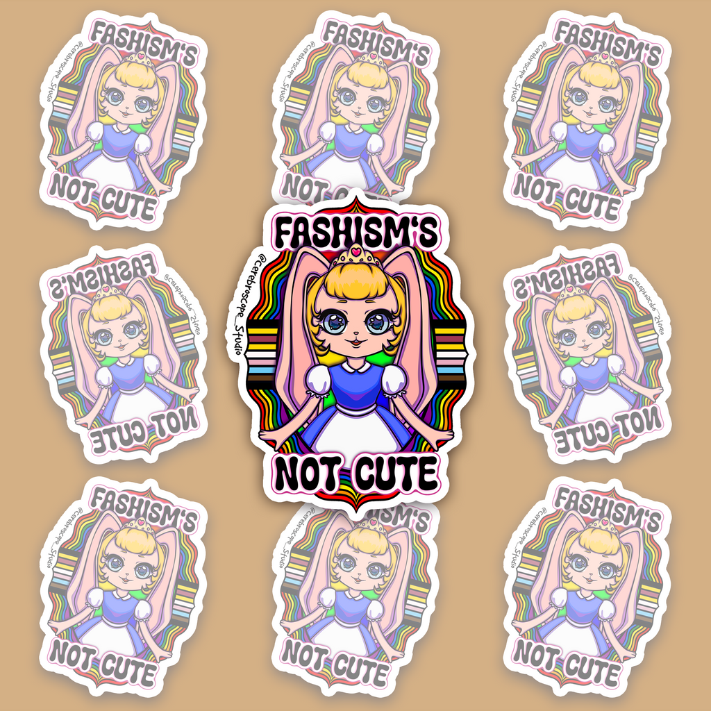 Pastel fantasy character surrounded by rainbow bands and black, brown, blue, pink and white Progress Pride colors with the words Fascism’s Not Cute.