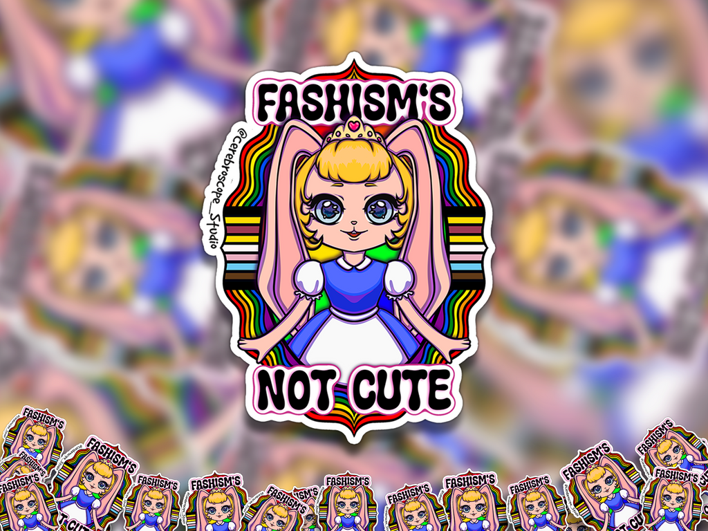 Alternate mockup 2: Pastel fantasy character surrounded by rainbow bands and black, brown, blue, pink and white Progress Pride colors with the words Fascism’s Not Cute.