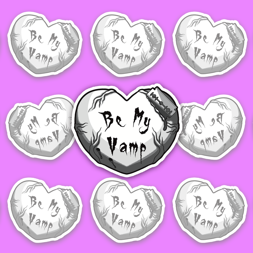 Pale heart with dark vein-like details, gothic text reading Be My Vamp, and a razor blade actively cutting into the upper edge.