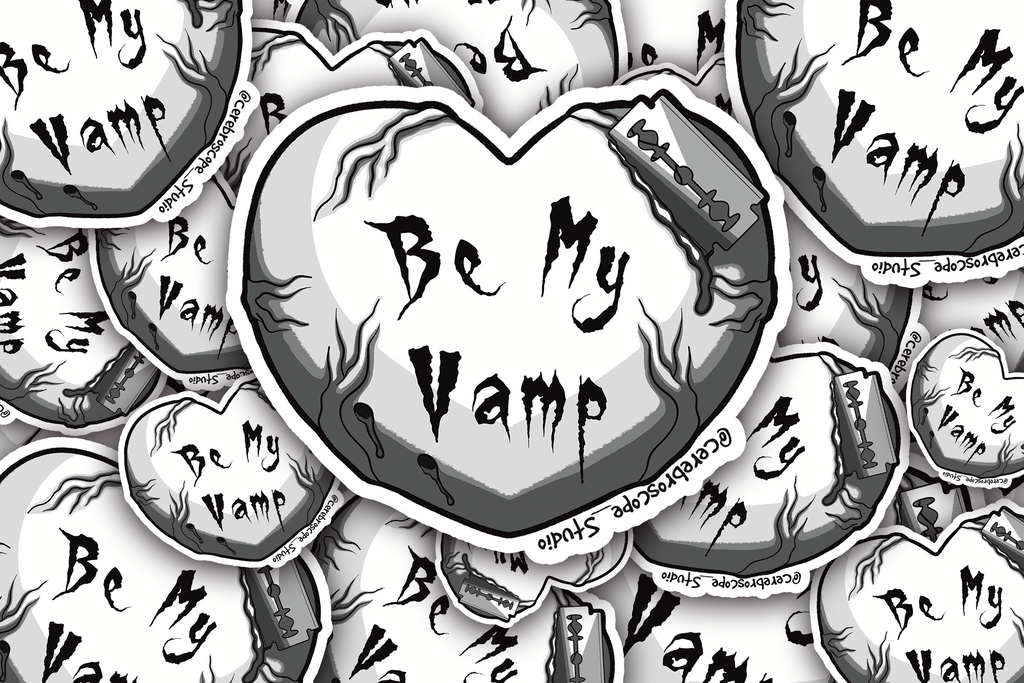 Alternate mockup 3: Pale heart with dark vein-like details, gothic text reading Be My Vamp, and a razor blade actively cutting into the upper edge.