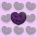 Deep purple heart with dark vein-like details, orange-red blood, gothic text reading Be My Vamp and a razor blade actively cutting into the upper edge.