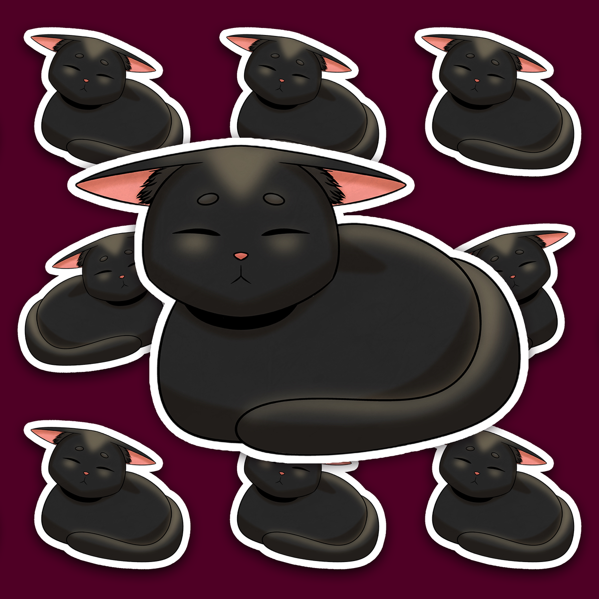 Round black cat resting with its paws tucked underneath and its long tail curled around the front of its body.