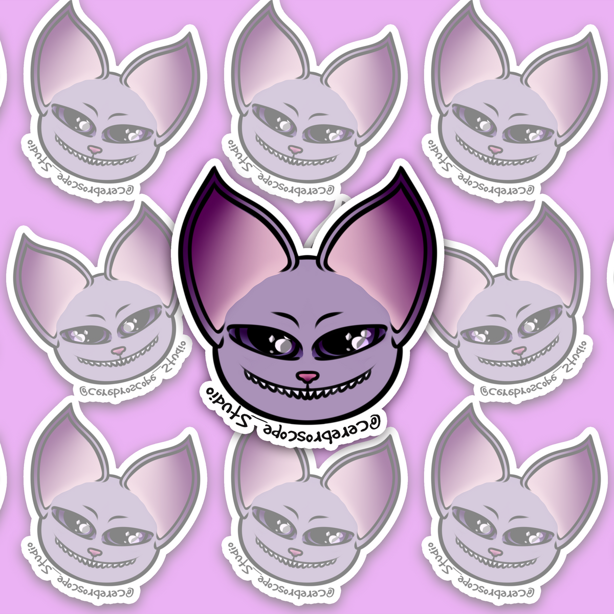 Lilac bat mascot face with oversized pointed ears, pink-purple inner ears, two glossy purple eyes, a pink nose and a wide pointed-tooth grin.