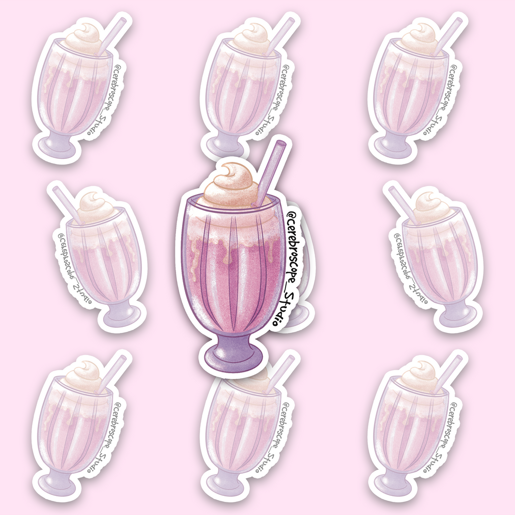 Pink strawberry milkshake in a tall fluted pedestal glass, topped with a pale cream swirl and an angled lilac straw, with a white sticker border.