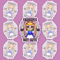 Crowned blonde character with long pink bunny ears and a blue-and-white dress, surrounded by colourful wavy bands and the text “FASHISM’S NOT CUTE.”
