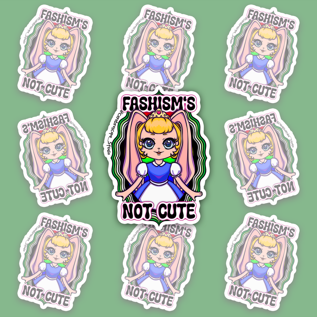Crowned blonde character with pink bunny ears and a blue-and-white dress, surrounded by wavy green, white, grey and black bands and “FASHISM’S NOT CUTE” lettering.
