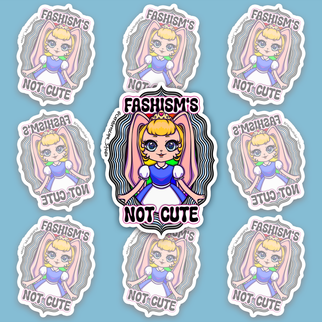 Crowned blonde character with long pink bunny ears and a blue-and-white dress, framed by wavy black, grey, white and light blue bands and “FASHISM’S NOT CUTE.”