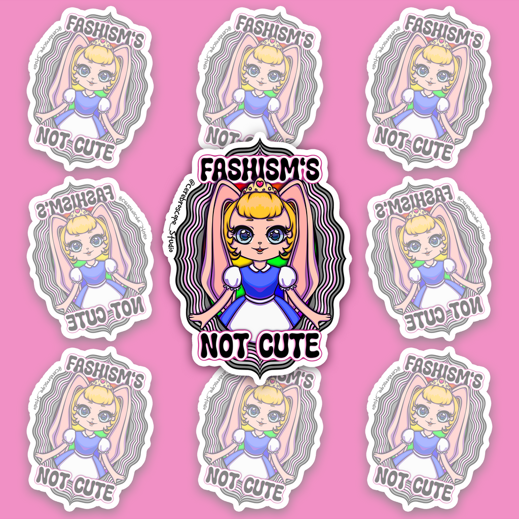 Crowned blonde character with long pink bunny ears and a blue-and-white dress, framed by wavy black, grey, white and pale pink bands and “FASHISM’S NOT CUTE.”