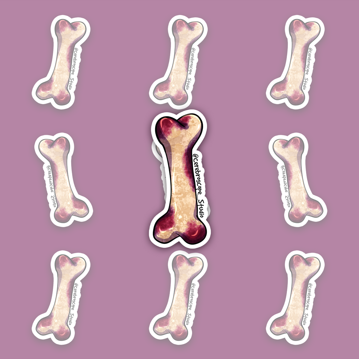 Cream-colored long bone with lilac, purple and burgundy staining around the ends and shaft.
