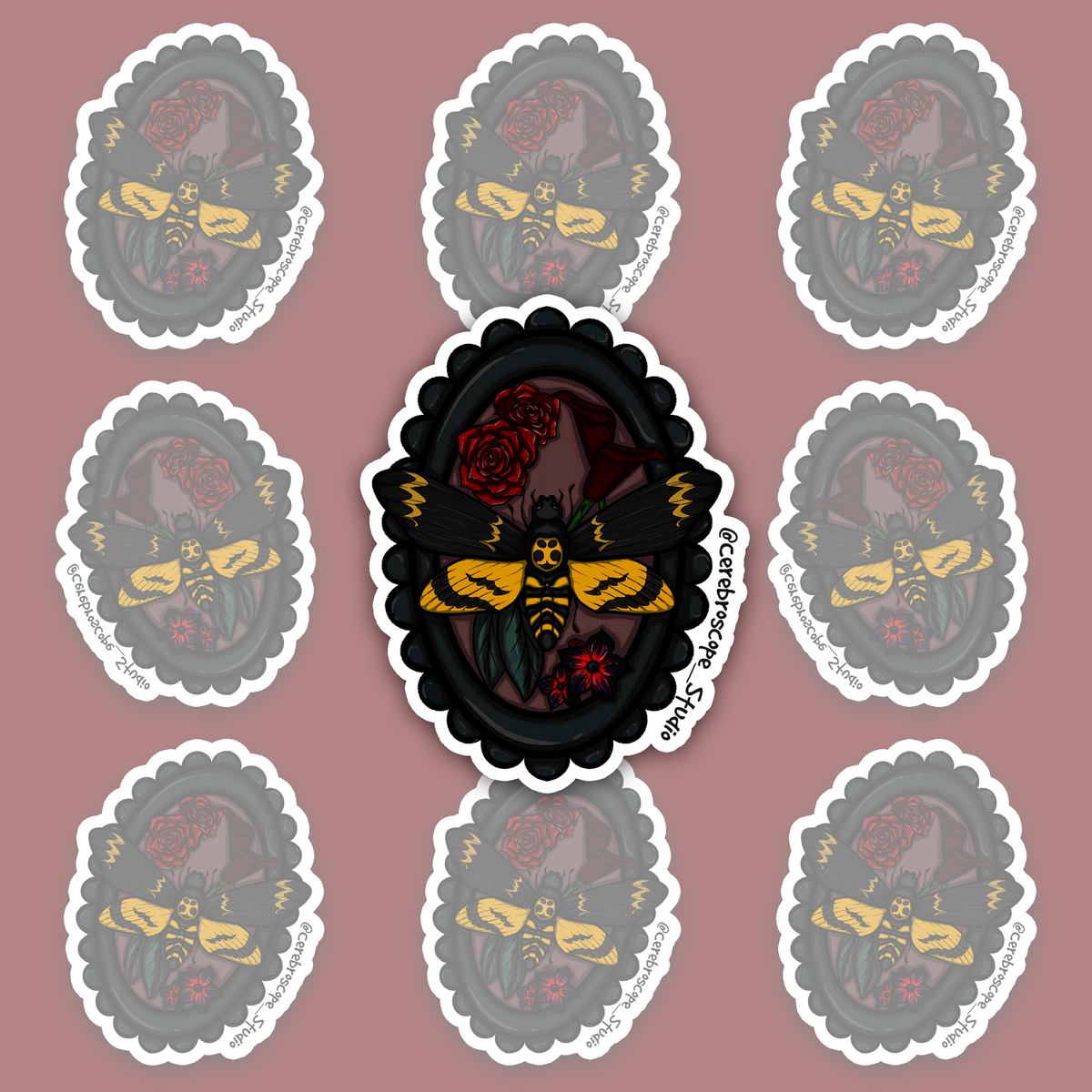 Death’s-head hawkmoth displayed in a black oval frame with red roses, dark leaves and gothic details.